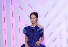 Chase Infiniti wears custom Louis Vuitton to the Opening ceremony during the Series Mania Festival Chase Infiniti wears a long blue satin dress featuring a pleated bustier with 3D detailing and a pair of silver platform.