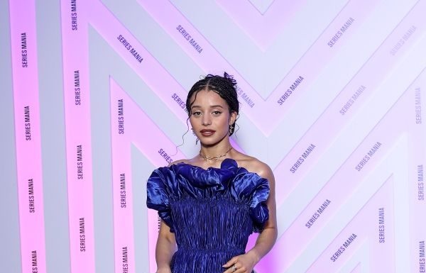 Chase Infiniti wears custom Louis Vuitton to the Opening ceremony during the Series Mania Festival Chase Infiniti wears a long blue satin dress featuring a pleated bustier with 3D detailing and a pair of silver platform.