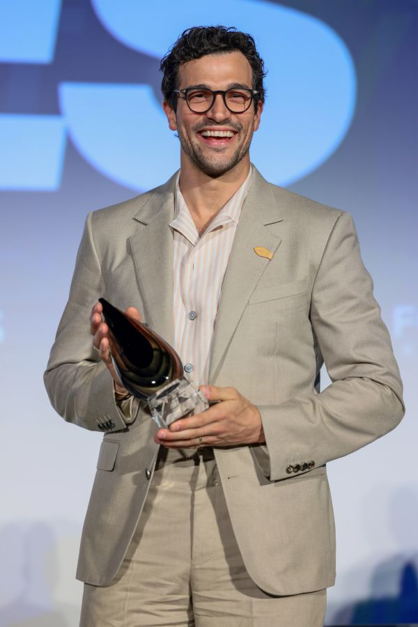 Paul Anthony Kelly receives the Breakout Artist Award wearing Louis Vuitton at the 2026 Newport Beach TV Fest
