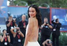 Esmeralda Pimental wears Stephane Rolland at the Venice Film Festival On the 6th of September 2026, ESMERALDA PIMENTAL was wearing a long backless trapeze dress in white wool gazar embroidered with silicone marble over organza ruching and white ostrich feathers STEPHANE ROLLAND HAUTE COUTURE – from the FW 26/27 collection – while attending the "The Echo Chamber" screening at the 83th Venice Film Festival.